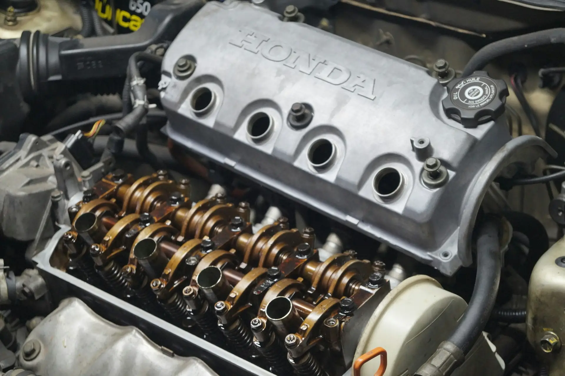 A used engine with its valve cover open